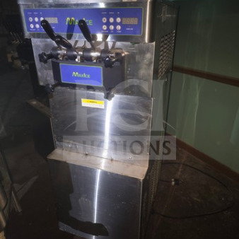 Max Ice M-320T soft serve ice cream machine, stainless steel, dual handles. Unknown working condition, sold as is.