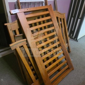 Lot of wooden crib panels with slatted design, medium brown finish, in good condition. Auction tag number 115 attached.