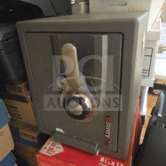 Sentry safe, gray, no key, combination unknown, sturdy build, shown on stacked boxes, some cosmetic wear.
