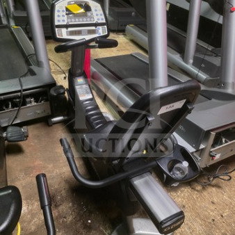 Cybex 530R Recumbent Exercise Bike, unknown working condition. Features digital display, ergonomic seat, sold as is.