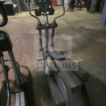 Life Fitness 91xi Commercial-Grade Elliptical Cross-Trainer, unknown condition, sold as is, shown in storage area.