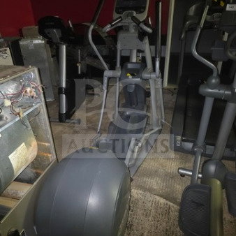 Precor EFX 576i Experience Series elliptical crosstrainer, unknown condition, sold as is, gray color, in gym setting.