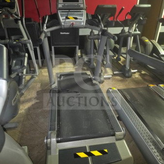 Freemotion commercial-grade treadmill, unknown working condition, sold as is, with console and warning stickers.