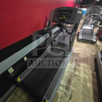Life Fitness Integrity Series CLST treadmill. Unknown condition, sold as is. Black and gray. Control panel visible.