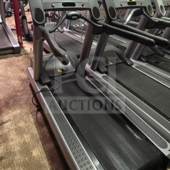 Life Fitness Integrity Series CLST Treadmill, gray, unknown working condition, sold as is, in a gym setting.