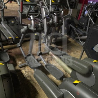 Life Fitness commercial-grade elliptical trainer, gray, unknown working condition, sold as is, no visible labels.