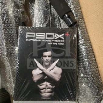P90X Extreme Home Fitness program box, sealed, includes Tony Horton workout DVDs.