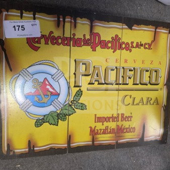 Vintage Pacifico beer sign, yellow with nautical design, reads "Cerveza Pacifico Clara." Good condition, wooden frame.