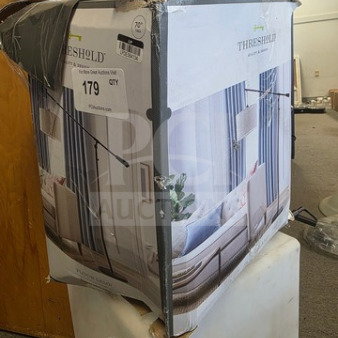 Threshold floor lamp in damaged box, condition unknown. Box shows image of lamp design, marked "179" and "Qty 1".