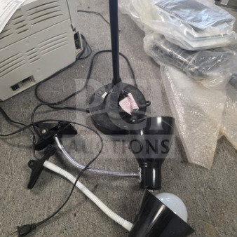Lot of miscellaneous lamps, including black clip-on lamp and standing lamp base. Mixed condition. No visible brand labels.