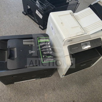 Lot of 2 printers in unknown working condition. Includes black and white models; sold as is.