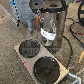 Stainless steel coffee airpot and decanter warming station, used condition, with dual burners. Item tag: 192.