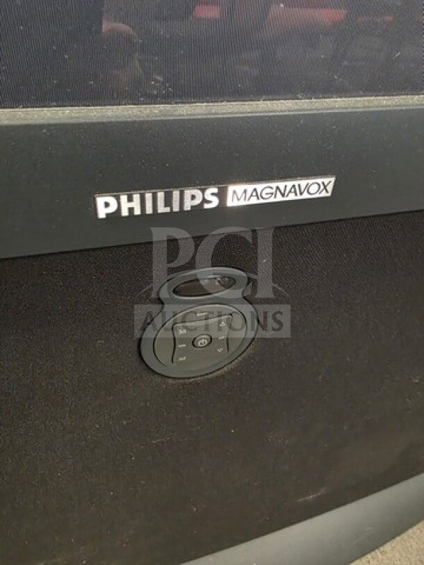 Philips Magnavox rear projection TV, front panel view with logo and control buttons, unknown working condition. Sold as is.
