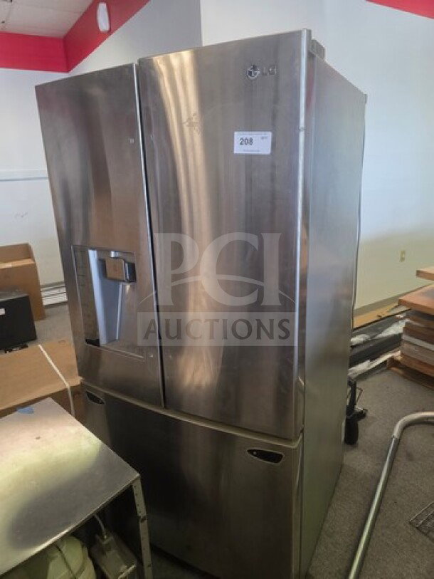 Stainless steel LG French door refrigerator, unknown working condition, sold as is, visible exterior wear.
