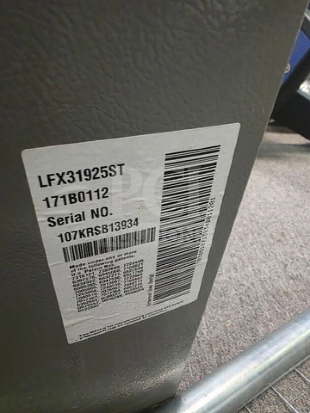 Stainless Steel LG French Door Refrigerator with label showing model LFX31925ST, sold as is, condition unknown.