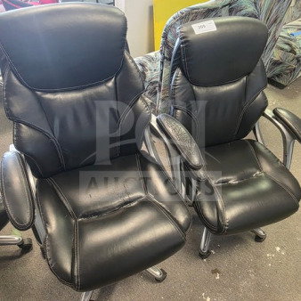 Lot of 4 black leather office chairs with padded armrests, chrome legs, and visible wear. Label marked "209".