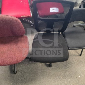 Lot of 3 mismatched office chairs, varying conditions. Includes red fabric, black mesh, and padded armchair. Visible wear on fabrics.