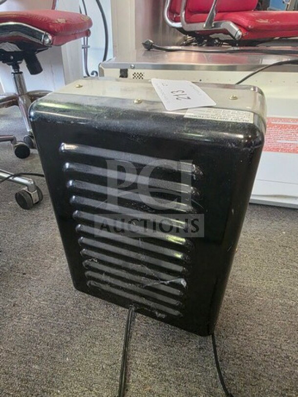Comfort Zone portable electric utility heater, black, vented front, unknown working condition, sold as is.