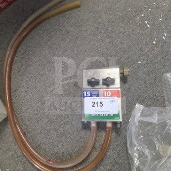 Multi-Clean Sink Station Dilution and Dispensing System with two hoses. Silver panel with control knobs. Good condition.