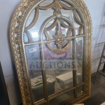 Elegant Palladian-style wall mirror with ornate gilded frame, arched top, and intricate design. Minor wear; ideal for decor.