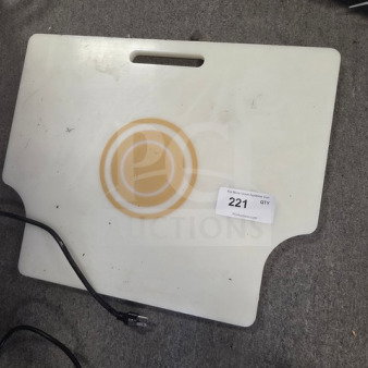 White cutting board with integrated handle, light wear, circular groove design, visible auction label "221 QTY."