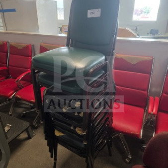 Lot of 9 stackable chairs, green upholstery, metal frame, shows signs of wear. Tag reads "222".