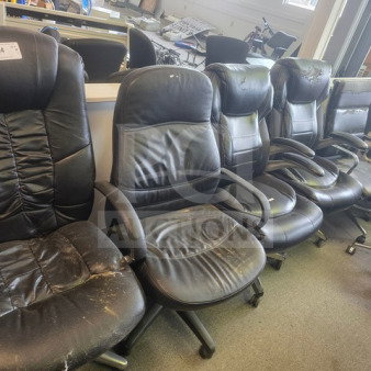 Lot of 12 black office chairs showing signs of wear; various styles and conditions, visible scuffs and tears on leather.