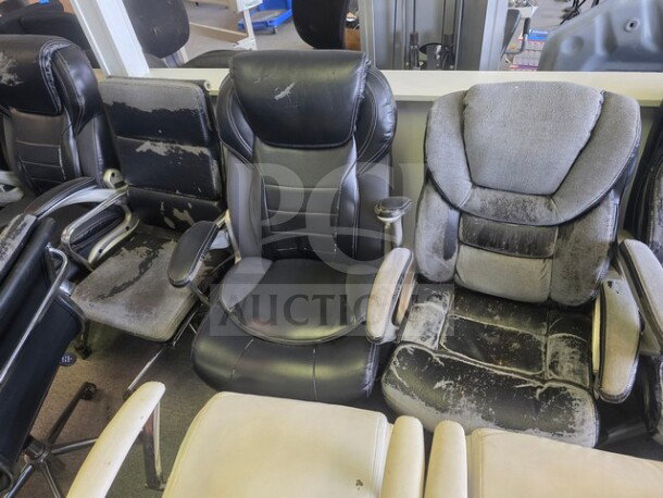 Lot of 12 miscellaneous office chairs showing signs of wear. Various styles and colors, with visible scuffs and damage.