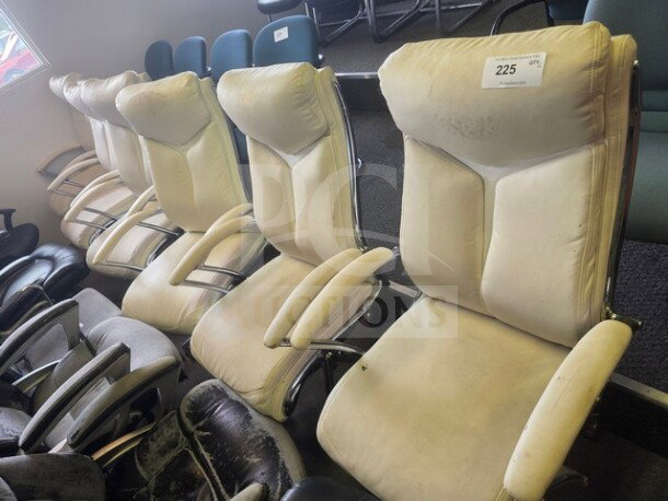 Lot of 6 beige office chairs with padded backrests and armrests. Shows signs of wear. Numbered tag "225" visible on one chair.