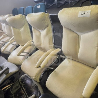 Lot of 6 beige office chairs with padded backrests and armrests. Shows signs of wear. Numbered tag "225" visible on one chair.