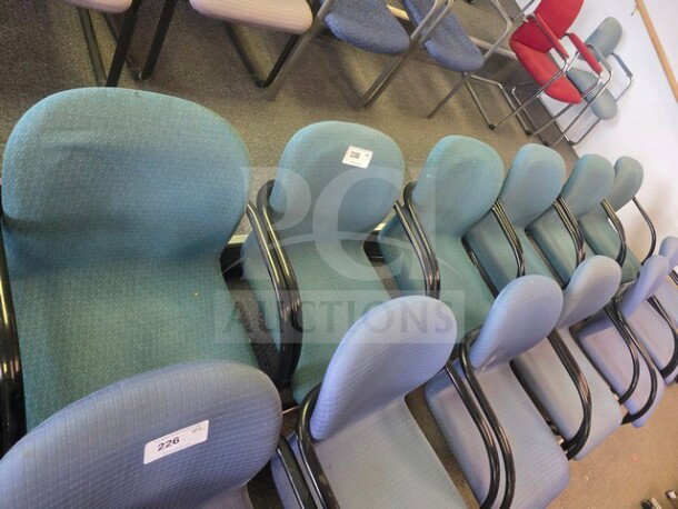 Lot of 6 blue office chairs with black armrests, fabric upholstery, slight wear, auction numbers 226 and 238 visible.