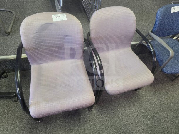 Lot of 2 office chairs with light fabric upholstery, black armrests, and minor wear. Numbered tags visible: 233, 234.