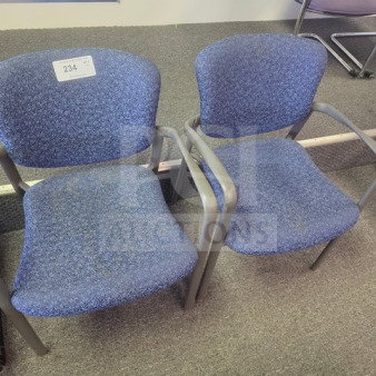 Lot of 2 blue fabric office chairs with gray metal frames, in used condition, labeled with auction number 234.