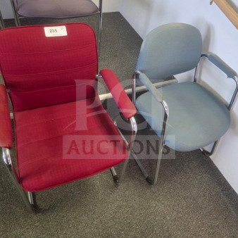 Lot of 2 office chairs; red fabric chair with label "235" and a blue fabric chair, both with metal frames, gently used.