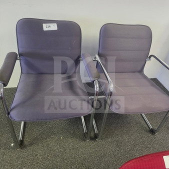 Lot of 2 purple office chairs with chrome frames and armrests. Minor wear visible. Label marked "236" on one chair.