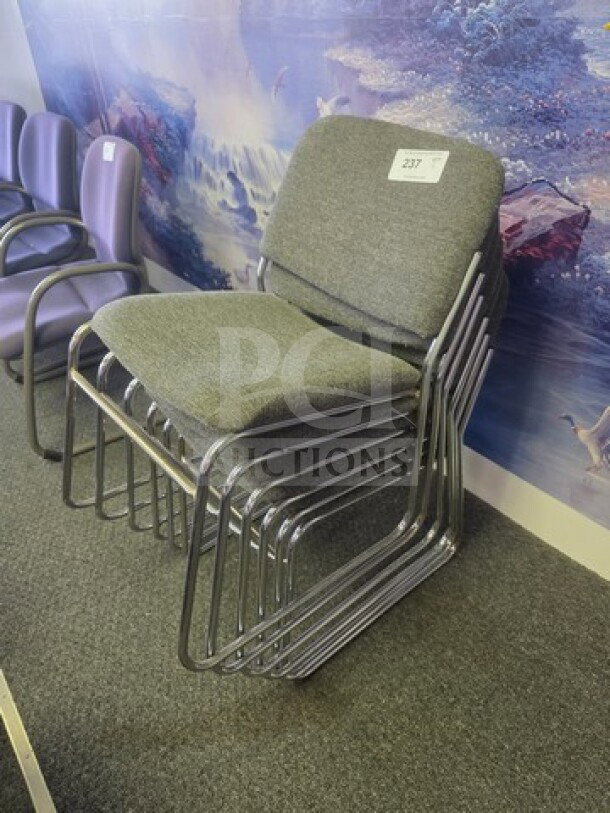 Lot of 6 stackable office chairs with gray upholstered seats, metal frames, and a tag indicating item 237.