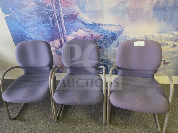 Lot of 3 purple office chairs with metal frames, fabric upholstery, and minor wear. Label marked "238" on one chair.