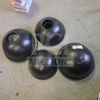 Four black Hybrid Athletics Atlas Stone Molds, varying sizes, used condition, markings visible for identification.