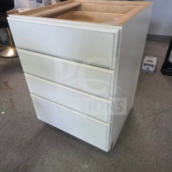 White drawer base cabinet with four drawers, minor wear on edges, no hardware, in clean condition.
