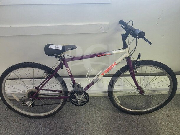 Trek 820 Antelope Mountain Bike, purple and white, sturdy frame, grip handlebars, 26-inch tires, used condition.