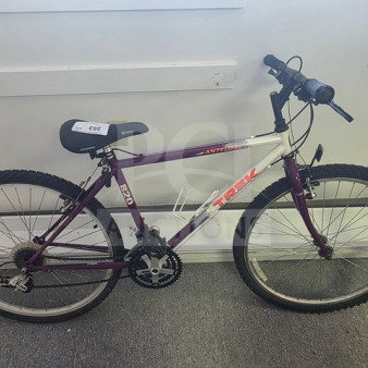 Trek 820 Antelope Mountain Bike, purple and white, sturdy frame, grip handlebars, 26-inch tires, used condition.