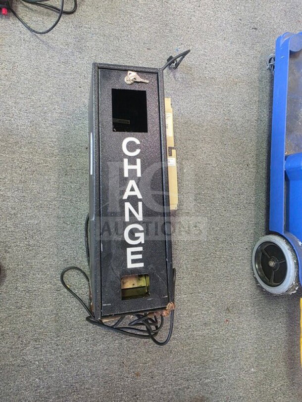 Dollar bill changer machine with "CHANGE" text on the front, black metal casing, visible wiring, used condition.