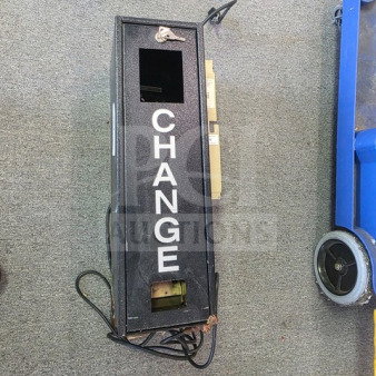 Dollar bill changer machine with "CHANGE" text on the front, black metal casing, visible wiring, used condition.