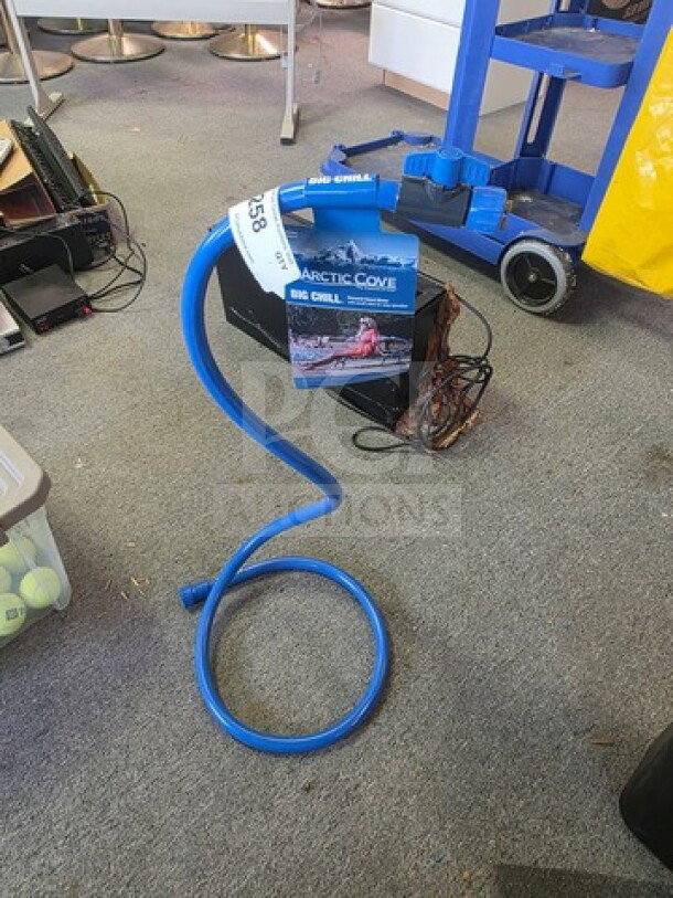 Arctic Cove personal stand mister with blue hose, new in box. Includes label indicating model. Ideal for outdoor cooling.