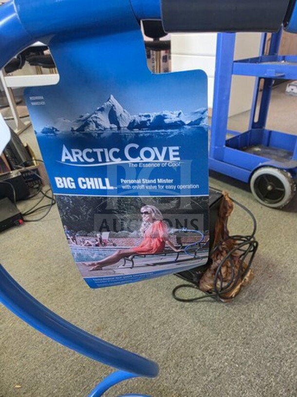 Arctic Cove Big Chill Personal Stand Mister with pivot valve, tag showing operation, on display; features easy operation.
