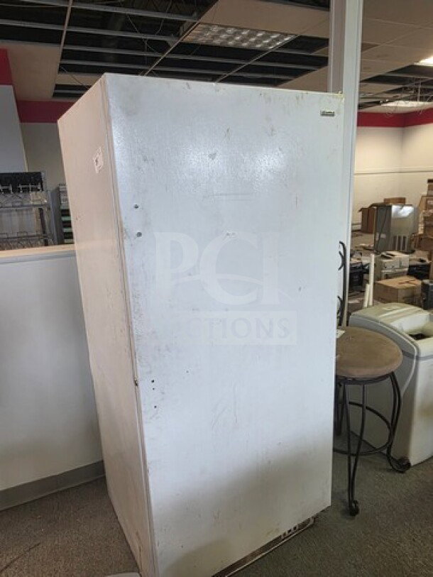 Kenmore upright freezer, white, used condition, visible scratches. Unknown working condition, sold as is.