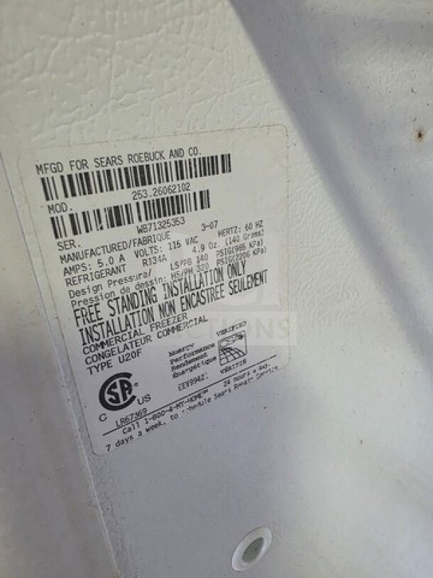 Kenmore Upright Freezer, model U20F, label detailing manufacturer and specs, condition unknown, sold as is.