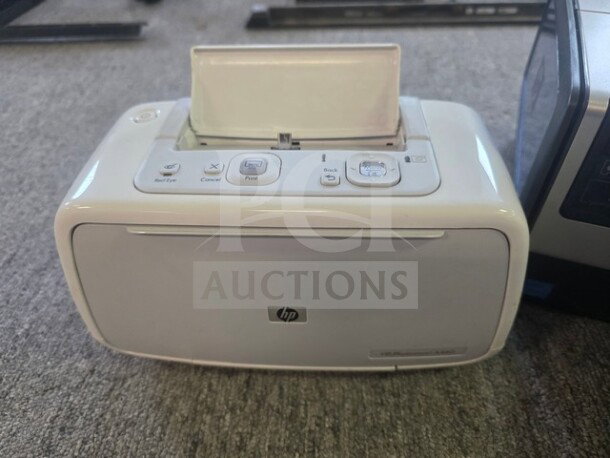 HP Photosmart and Deskjet printers, unknown working condition, sold as is. Visible HP logo, multiple control buttons.