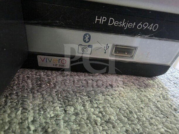 HP Deskjet 6940 printer detail showing USB port and Bluetooth icon, Vivera HP Inks label, unknown working condition. Sold as is.
