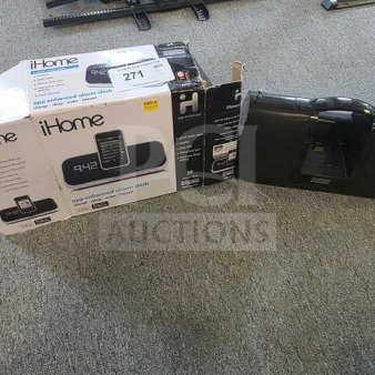 One lot with iHome app-enhanced alarm clock in box and iLuv player. Unknown working condition, sold as is.